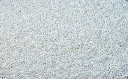 Background - raw tapioca seedson the wooden matの写真素材