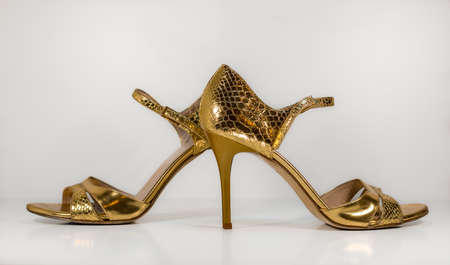 Pair of gold woman tango shoes - beautiful dance from Argentinaの写真素材