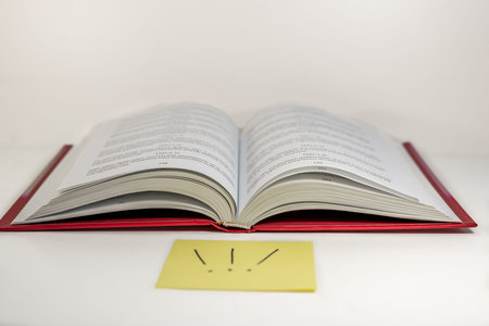 Opened book on the table - ancient knowledge