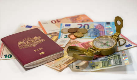 Passport, money and compass - ready to travel anywhereの写真素材