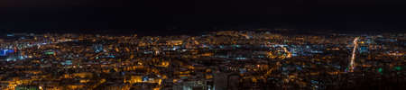 Panorama of night view on beautiful old city of Lviv from high hill - landscapeの写真素材