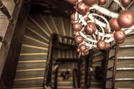 Spiral view of round stairs looking down with Christmas decoration brown colorの写真素材