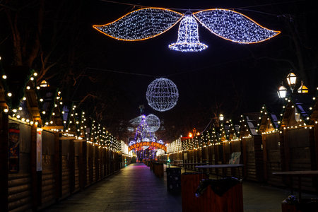 Night scene - empty Christmas marketplace with decorated small kiosk in Lvov Ukraineの写真素材