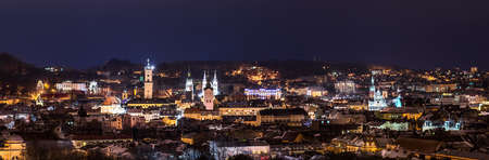 Panorama of night view on beautiful old city of Lviv from high hill - landscapeの写真素材