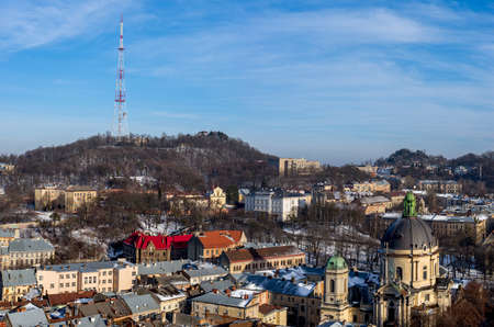 Winter panorama - landscape of old town with red roofの写真素材