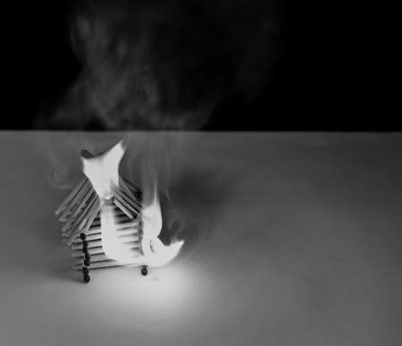 Burning matches house - dangerous games with fire ends with accidentの写真素材