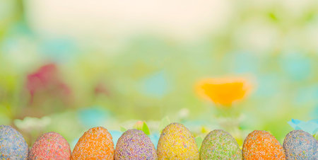 Row Easter eggs with spring green grass background - celebrationの写真素材