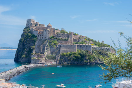 Ancient castle on the island in the blue seaの写真素材