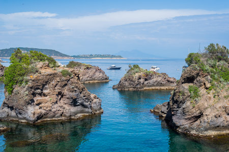 Rock islands in the blue sea with boats - summer holidays