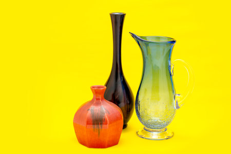 set black, red antique ceramic vase. decorative ceramic pot on yellow background. brown modern porcelain vase for room interior. vintage handmade glaze pottery flowerpot office decoration collectionの写真素材