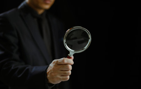 Man use magnifying glass. Businessman search for top sale seo, digital data information. Human...