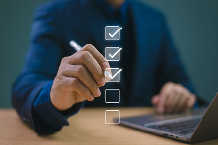 Business performance evaluate checklist review, businessman using pen computer online checklist...