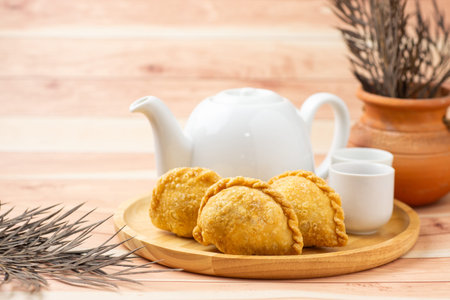 Curry puff, white teapot set isolated on white background. Samosa chicken fried curry bakery, meat,...
