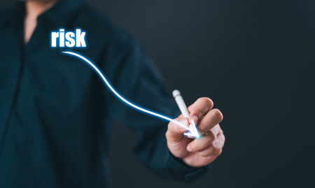 Low risk business control level concept. Businessman use pen to analyze risk opportunities, plan business risk level indicators. Lower rating to high digital virtual measure. Risk management financialの写真素材
