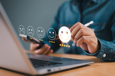 Customer satisfaction survey concept. Questionnaire business experience feedback service. Client use pen review happy face 5-star satisfaction rating online application. Check evaluate product qualityの写真素材