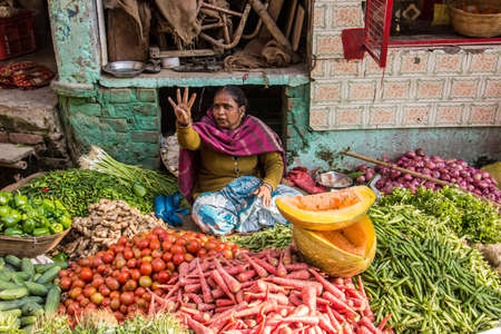 A market seller in Varanasi, selling vegetablesのeditorial素材