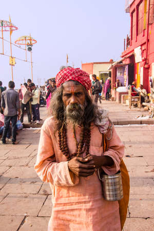 Sadhu standing on the ghats of the  holy city of Varanasiのeditorial素材