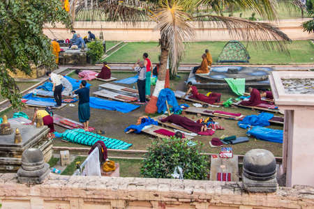 People are performing prostrations near the famous Mahabodhi temple, Indiaのeditorial素材