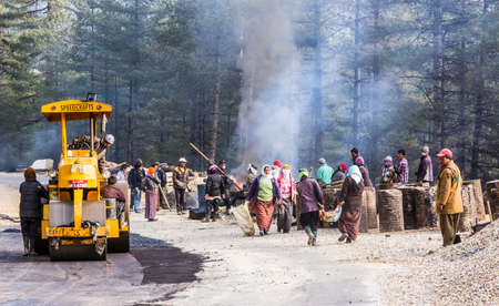 Many people working at the highway of Bhutan  Most of the work is done by hand  のeditorial素材