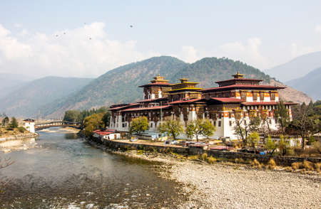 The majestic dzong of Punakha, Bhutan, is situated between two rivers. Dzongs are fortress like buildings which house a monastery and administrative offices.のeditorial素材