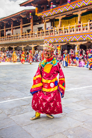 masked dancers at  drupchen festival in the dzong of Punakha, Bhutan  Drupchen festival is taking...