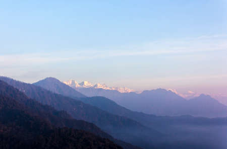 View from ducho la pass in the early morning to the snow covered 8000m peaks of the himalaya  There is still fog in the valleys の写真素材
