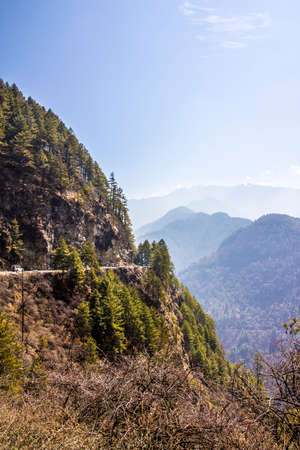 The national highway of Bhutan passes over steep mountains  The view is breathtaking の写真素材