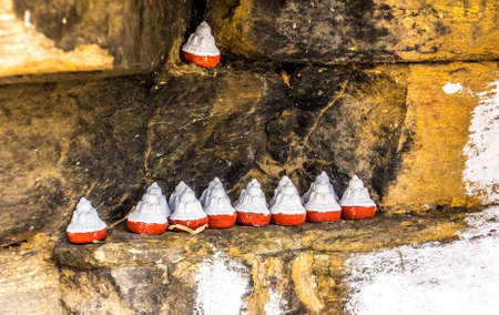 Tzatzas are cones made of ashes, sometimes human ashes. they are placed in caves, underneath overhanging stones or at stupas or temples.の写真素材