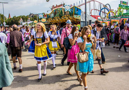 Oktoberfest Munich  Young people, dressed in dirndls, are having fun のeditorial素材