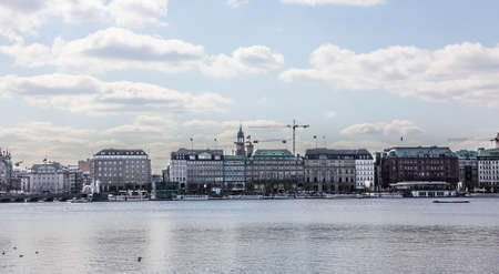 Buildings at the famous \ "Jungfernstieg \" or virgin path, the experiment street at the bank of the inner Alster.のeditorial素材