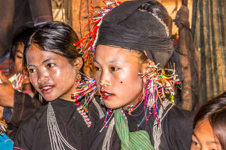 Women of the Ene tribe posing on the terrace of theit houseのeditorial素材