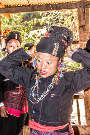 Women of the Ene tribe posing on the terrace of theit houseのeditorial素材