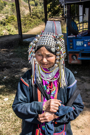 Woman of the Akha tribe is selling handmade goods