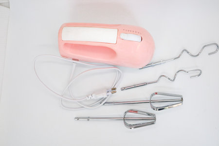 Hand mixer pink isolated on white, Mixer blade or propeller isolated on whiteの写真素材