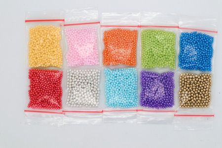 Colorful cake decoration knickknacks isolated on whiteの写真素材