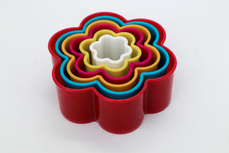 Star, rose and heart shaped cake molds isolated on whiteの写真素材