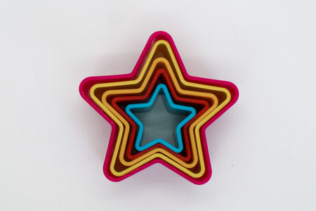 Star, rose and heart shaped cake molds isolated on whiteの写真素材