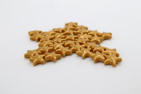 Colorful cake decoration knickknacks isolated on whiteの写真素材