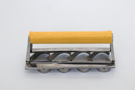 Heart shaped cake mold isolated on whiteの写真素材