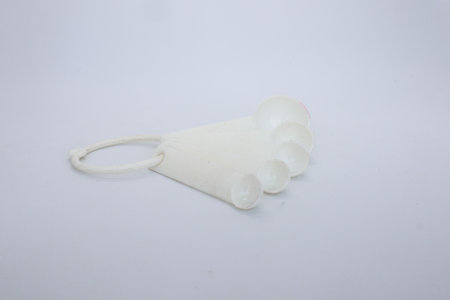 A set of cake spoons for cake decorating needs isolated on whiteの写真素材