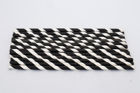 Black and white patterned straw isolated on whiteの写真素材