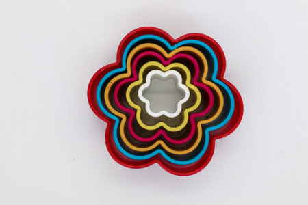 Star, rose and heart shaped cake molds isolated on whiteの写真素材