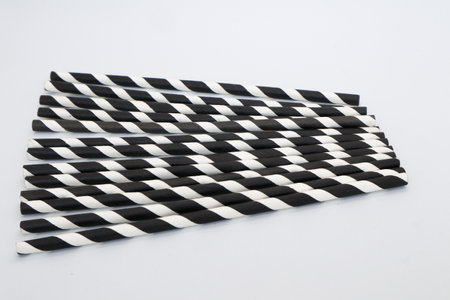 Black and white patterned straw isolated on whiteの写真素材