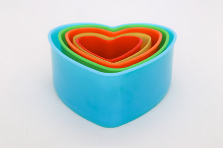 Star, rose and heart shaped cake molds isolated on whiteの写真素材