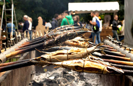 smoked fish closeup roasted on the fireの写真素材