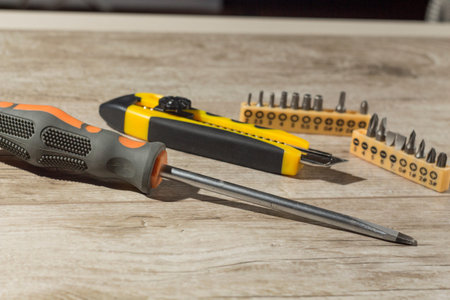 tools, screwdriver ,knife Wallpaper and attachments for drills are on the table