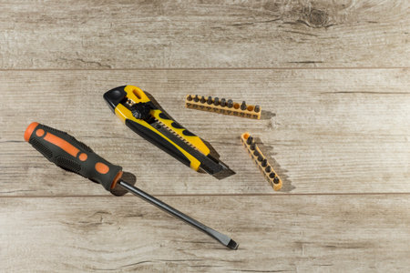tools, screwdriver ,knife Wallpaper and attachments for drills are on the table