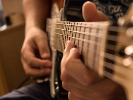hand with guitar close-up5