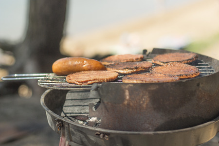 Sausage grill is grilled on a grillの写真素材
