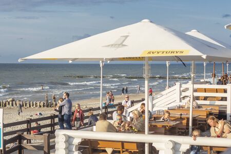 Russia. Zelenogradsk 2019.coastal cafe stands on the beach.people walk along the shoreのeditorial素材